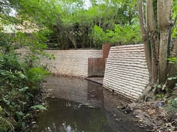 A reconstructed retaining wall using Soluform's concrete bagwork solution